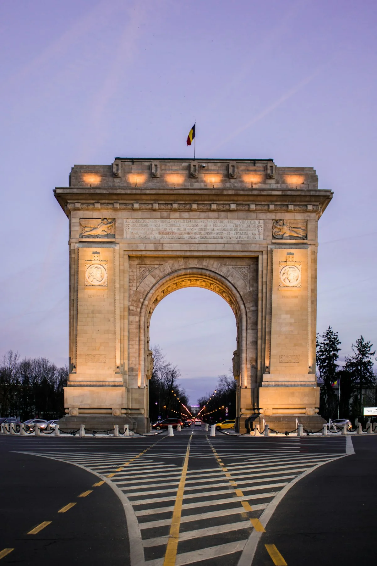 The Arch of Triumph in Bucharest at dusk