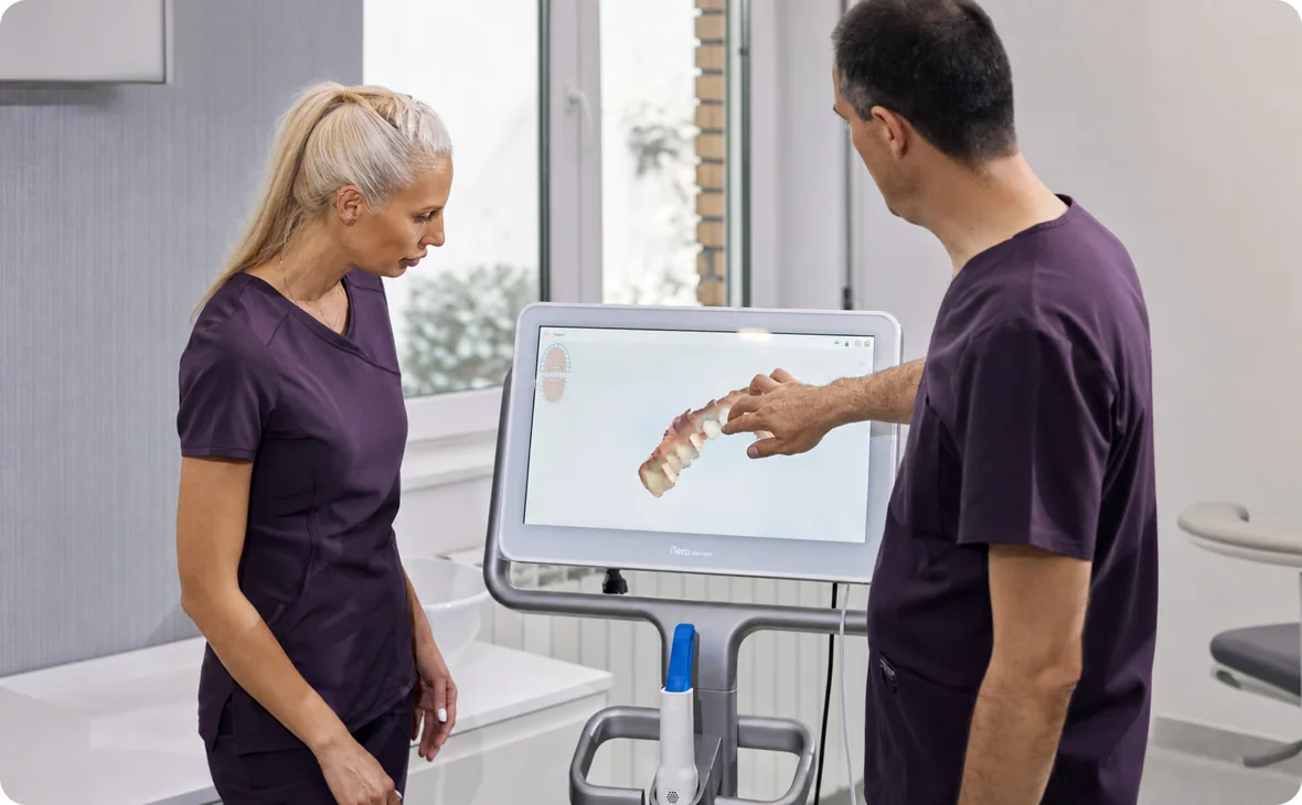 Dental professionals reviewing a digital tooth scan